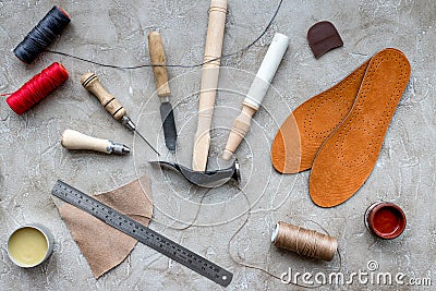 Clobber preparing his tools for work. Grey stone desk background top view Stock Photo