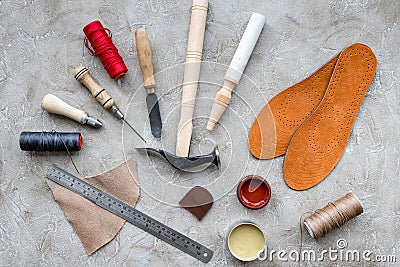 Clobber preparing his tools for work. Grey stone desk background top view Stock Photo