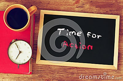 Clock, coffee cup and blackboard with the phrase time for change Stock Photo