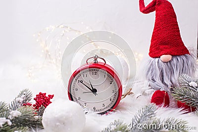 Clock, decorative elf or gnome with fairy lights Stock Photo