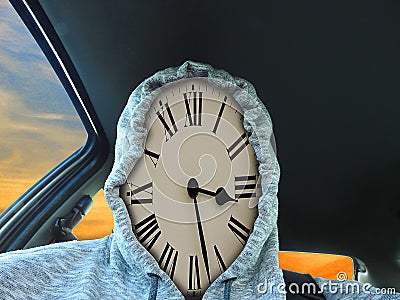 Clock face time piece wearing hoodie driving car late appointment Stock Photo