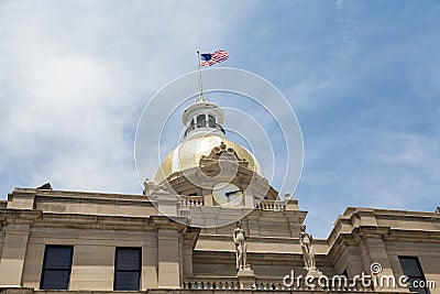 Clock Gold Dome and American Flag on City Hall Stock Photo