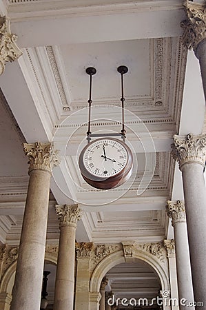 Clock hanging in an archway Stock Photo