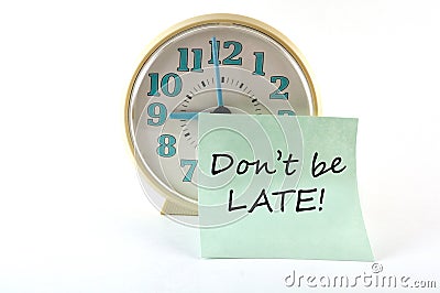 Clock with sticker Don`t be late. General concept Stock Photo