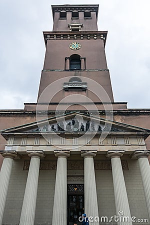 Clock tower of Church of Our Lady Vor Frue Kirke situated on Frue Plads public square in central Copenhagen, next to the Stock Photo