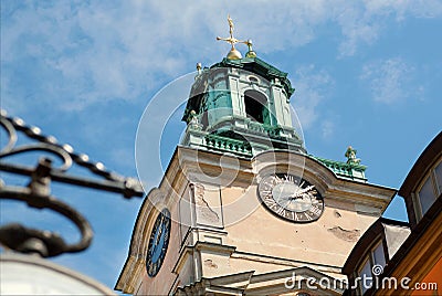 Clock tower on historical church Storkyrkan of Gamla Stan, Old Town in Sockholm, Sweden. Stock Photo