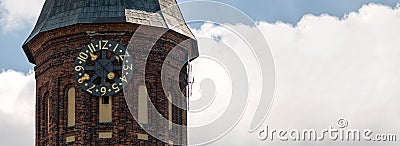 Clock tower of Konigsberg Cathedral, copy space. Brick Gothic-style monument in Kaliningrad, Russia. Immanuel Kant island Stock Photo