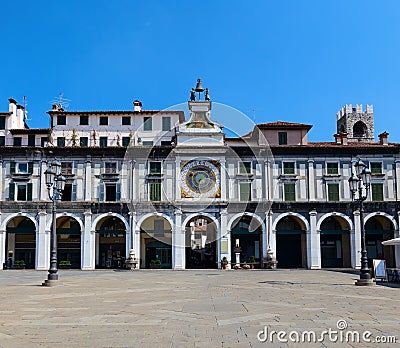 Clock tower on the Piazza della Logia Stock Photo