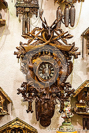 Clock. Vintage cuckoo clocks in shop, Bavaria, Munich, Germany Editorial Stock Photo