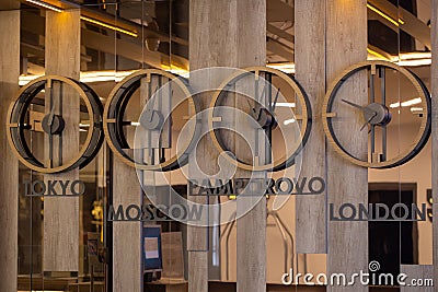 Clocks with different time zones on the hotel reception wall Stock Photo