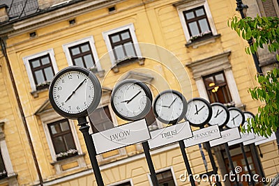 Clocks showing the current time in cities around the world. Krakow, Poland Stock Photo