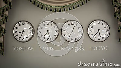 Clocks on a wall with time zone of different country Stock Photo