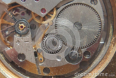 Clockwork. Gears, springs and other parts of the watch are visible. Stock Photo