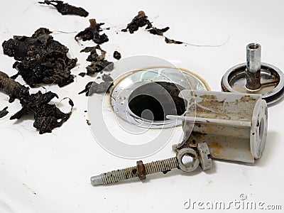 Clogged sink in bathroom and pipe cleaning Stock Photo