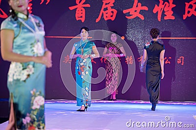 Cloisonne-Female cheongsam show Editorial Stock Photo