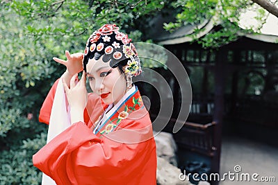 Close Aisa Chinese actress Peking Beijing Opera Costumes Pavilion garden China traditional role drama play dress perform ancient Stock Photo