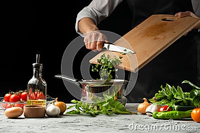 Close the chef& x27;s hands, preparing an Italian tomato sauce for ma Stock Photo