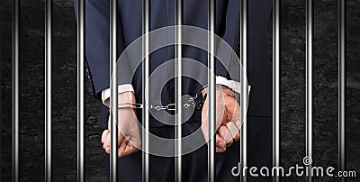 Close handcuffed man in jail Stock Photo