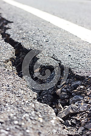 Close cracked asphalt blur. Stock Photo