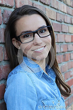 Close face of brunette female with glasses Stock Photo