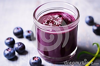 close focus on blueberry puree in a glass container Stock Photo