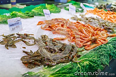 Close fresh raw shrimps on display on ice on fishermen market store shop Stock Photo