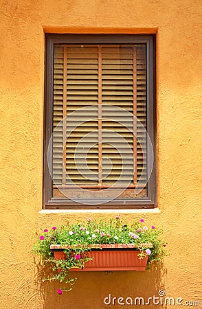 Close glass window on orange wall Stock Photo