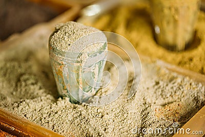 Close Grated Nutmeg Fragrant Seasoning Condiment In Glass In Tra Stock Photo