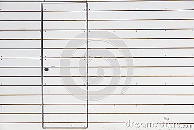 Close grey door with aluminium or steel wall Stock Photo