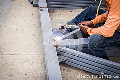 Close hand man arc welding or stick welding Stock Photo