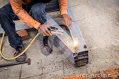 Close hand man arc welding or stick welding Stock Photo