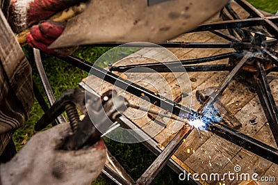 Close hand man arc welding or stick welding iron Stock Photo