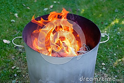 Close of a home made metal garden incinerator. Stock Photo