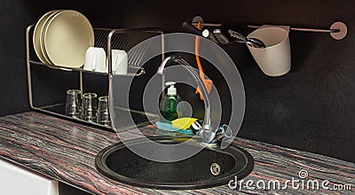 A close kitchen with dishes and a sink Stock Photo