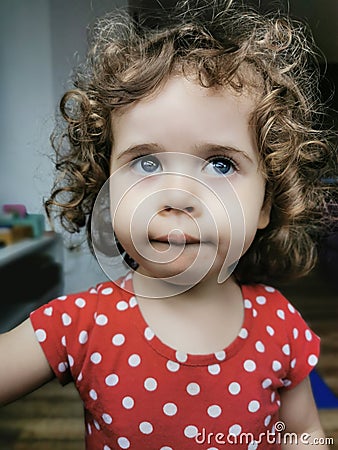 Close of Little Brazilian girl looking to the side outdoors Stock Photo