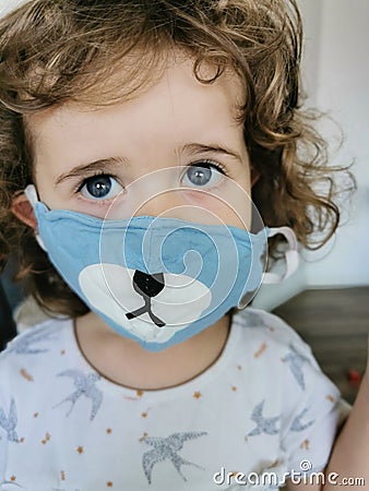 Close of Little Brazilian girl using mask on quarantine Stock Photo