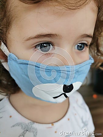 Close of Little Brazilian girl using mask on quarantine Stock Photo