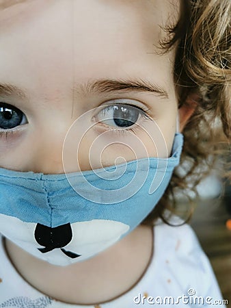 Close of Little Brazilian girl using mask on quarantine Stock Photo