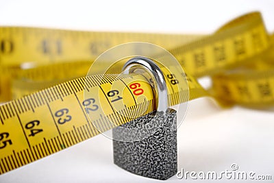 The close padlock on sewing metre Stock Photo