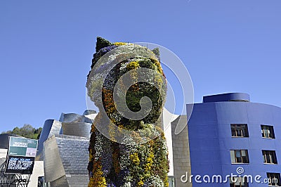 Puppy Floral Sculpture details front of Guggenheim Museum building from Bilbao city in Basque Country of Spain Editorial Stock Photo