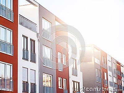 Close rows of bright sun over apartments Stock Photo