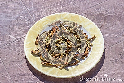 Close shoot of string beans dried under the sunlight on the plate Stock Photo