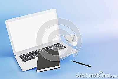 Close up of abstract desktop with empty white laptop computer screen, notepad, coffee cup and other supplies on blue background. Editorial Stock Photo