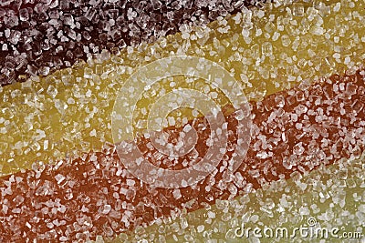 A close up abstract macro photo of a sugar coated multi coloured jelly fruit sweet Stock Photo