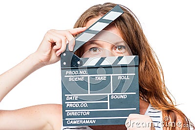 Close-up of an actress looking after a movie clapper on a white Stock Photo