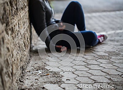 Close up of addict woman and drug syringes Stock Photo