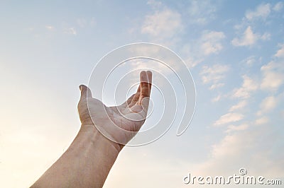 Adult hand reaching out towards the sky Stock Photo