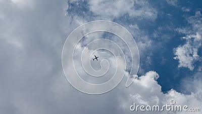 Aeroplane flying over the clouds of a blue sky Stock Photo