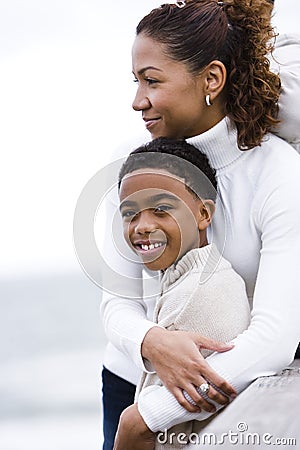 Close-up of African-American mother embracing son Stock Photo