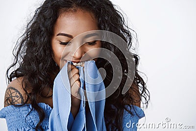 Close-up african-american tender and romantic curly-haired female with clean skin, no blemishes, laughing happily, hold Stock Photo